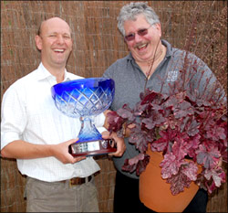 Patrick Fairweather, director of Aline-Fairweather joins Dan Heims, president of TERRA NOVA® Nurseries to cheer the success of Heuchera 'Midnight Rose'